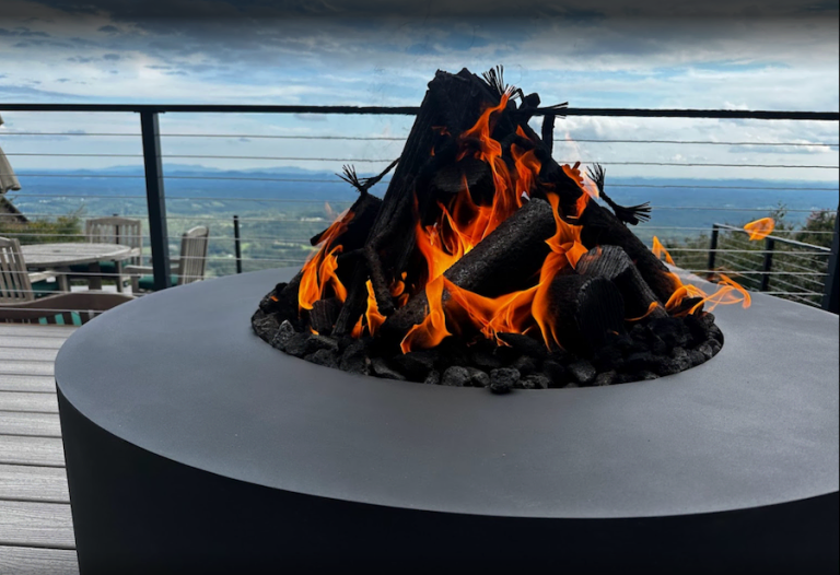 Handcrafted weathering steel custom fire pit with rust patina and flames